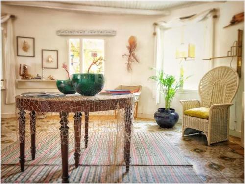 a living room filled with furniture and a table at Villa Margherita in Favignana