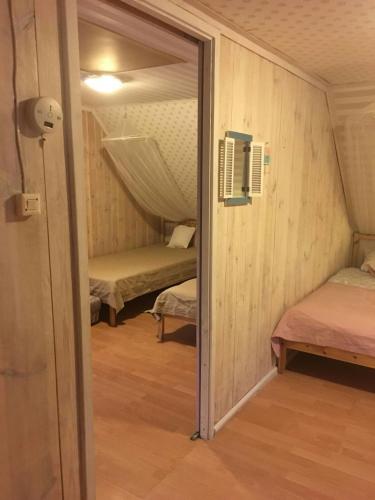 Postel nebo postele na pokoji v ubytování Domek PoZiomek