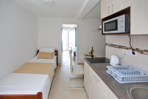 Postel nebo postele na pokoji v ubytování Apartments Brankica