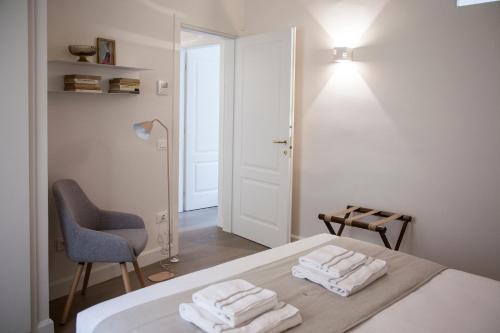 Ένα ή περισσότερα κρεβάτια σε δωμάτιο στο Pietrapiana Boutique Apartments