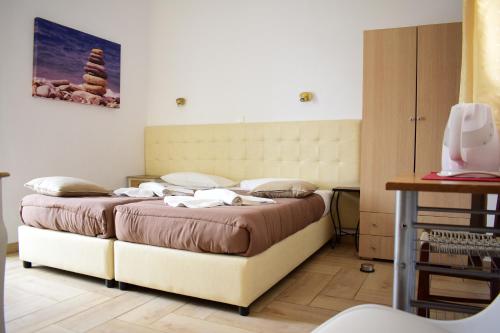 a bedroom with two beds in a room at Marinakis Sea View Studios in Sougia