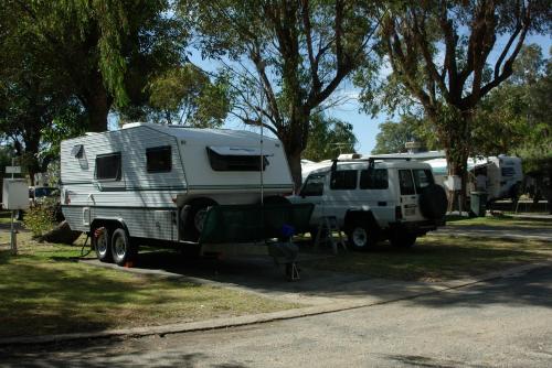 an rv and a truck parked next to each other at Acclaim Swan Valley Tourist Park in West Swan