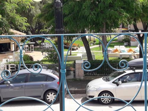 a couple of cars parked in a parking lot at B&B La Pavoncella in San Teodoro