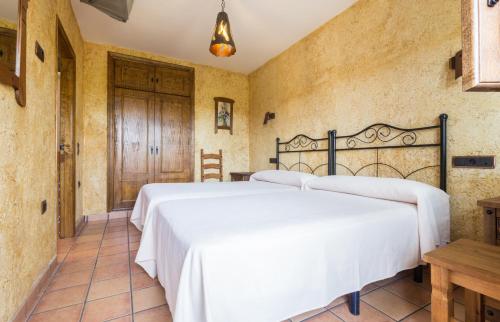 Postel nebo postele na pokoji v ubytování Cortijo Moyano