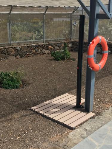 an orange life preserver on a playground at Casa de Los Alberconcillos in Agüimes