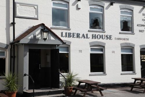 a white building with a sign that reads lateral house at Liberal House Tamworth in Tamworth