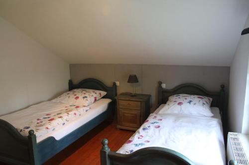 Ένα ή περισσότερα κρεβάτια σε δωμάτιο στο Ferienwohnung Haus Stein