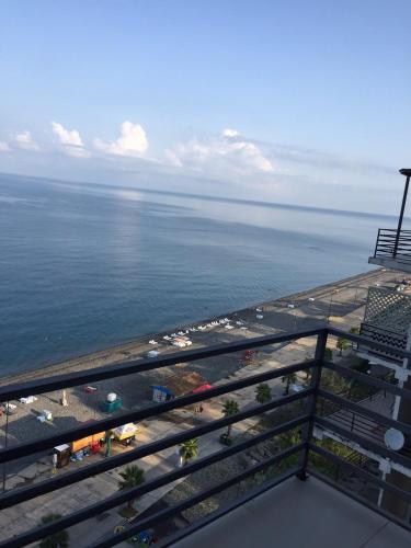 a view of the ocean from the balcony of a resort at Kvariati apartamenrs in Kvariati