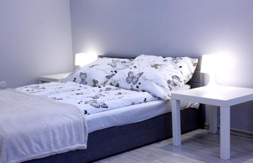 מיטה או מיטות בחדר ב-Zielona Przystań