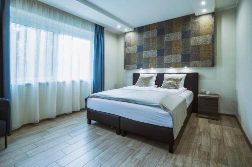 Ένα ή περισσότερα κρεβάτια σε δωμάτιο στο Premium Apartman