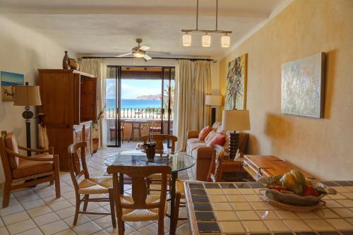 a living room with a couch and a table at Condominios El Dorado II in Cabo San Lucas