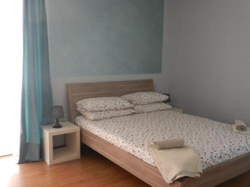 Ein Bett oder Betten in einem Zimmer der Unterkunft La Pergola