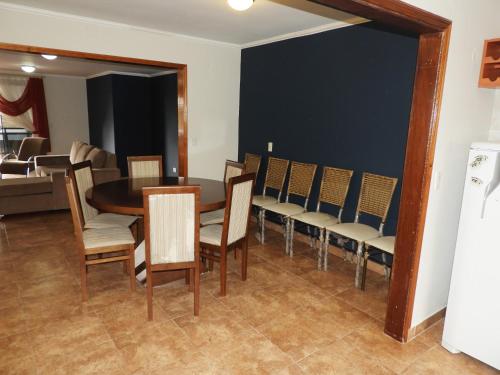 a dining room with a table and chairs at Hotel Puesta del Sol by Nobile in Encarnación