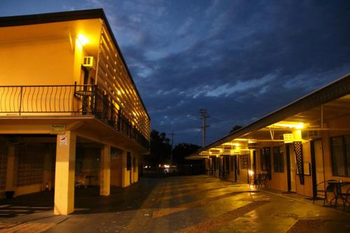an empty street in a building at night at Bourbong St Motel in Bundaberg