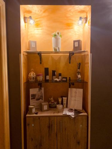a wooden shelf with items on it in a room at Fratelli Clemente Spa and Hotel in Castelvetrano Selinunte