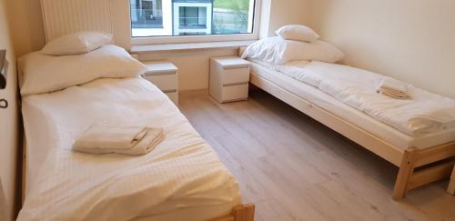 Ένα ή περισσότερα κρεβάτια σε δωμάτιο στο Apartament Kraków Arena