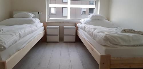 Ένα ή περισσότερα κρεβάτια σε δωμάτιο στο Apartament Kraków Arena