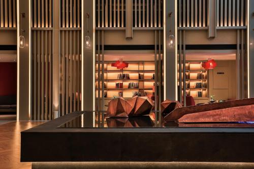 a room with a table and a wine cellar at Harbin Week Inn Hotel in Harbin