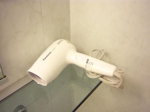 a blow dryer sitting on top of a counter top at Osaka Dai-ichi Hotel in Osaka