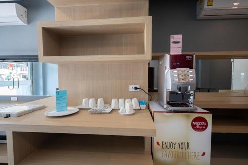 a kitchen with a coffee machine on a counter at Nora LakeView in Chaweng