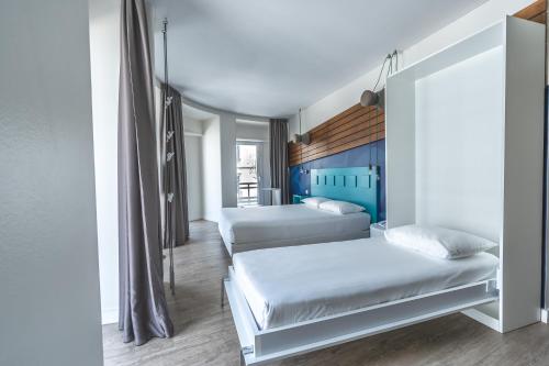 En eller flere senge i et værelse på Ibis Styles Lisboa Centro Liberdade NE