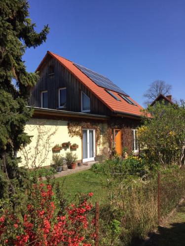 a small house with a red roof at Nice room in green Pankow district in Berlin
