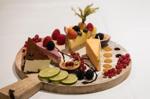 a plate of food with different types of desserts at Klækken Hotel in Hønefoss