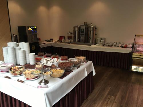 a buffet table with bowls of food on it at Tatralandia-Liptov Chatky in Liptovský Mikuláš