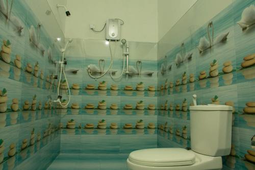 Vonios kambarys apgyvendinimo įstaigoje Eagle Resort Arugambay