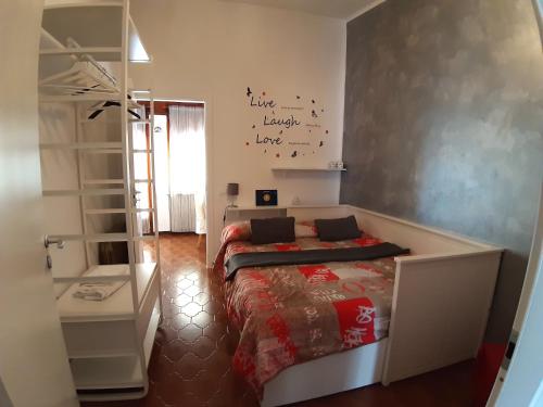 a bedroom with a bed and a book shelf at Terrazza in Manarola