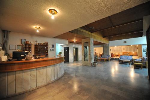 a lobby with a bar and a living room at El Greco in Igoumenitsa