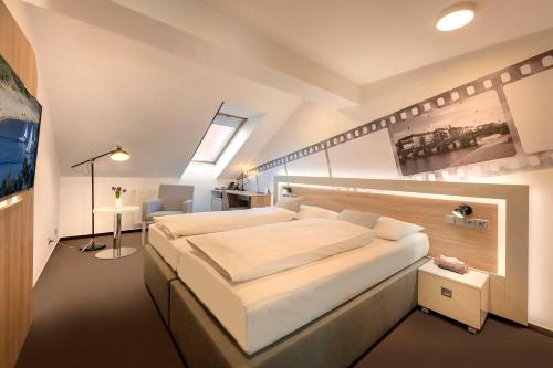 Postel nebo postele na pokoji v ubytování Hotel Biograf