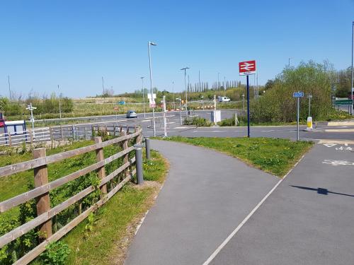 a bike path next to a road with a fence at Chatterley House in Nottingham