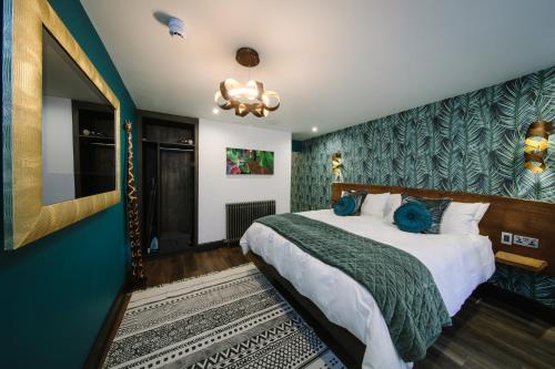 Ένα ή περισσότερα κρεβάτια σε δωμάτιο στο Absoluxe Suites