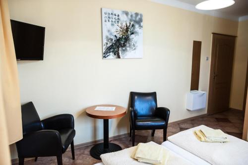 Postel nebo postele na pokoji v ubytování Penzion Eden