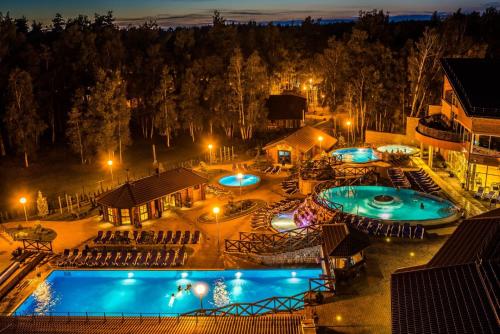 an overhead view of two pools at night at Meguva Resort Hotel in Palanga