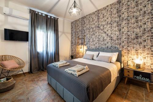 Ένα ή περισσότερα κρεβάτια σε δωμάτιο στο SUN SMILES in Naousa, Paros