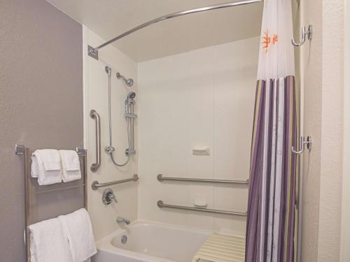 a bathroom with a shower and a bath tub at La Quinta by Wyndham Oklahoma City - NW Expwy in Oklahoma City