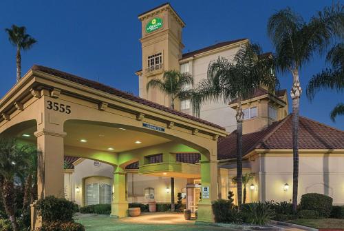 a building with a clock tower on top of it at La Quinta Inn & Suites by Wyndham Ontario Airport in Ontario