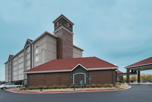 a large building with a clock tower on top of it at La Quinta by Wyndham Oklahoma City - NW Expwy in Oklahoma City