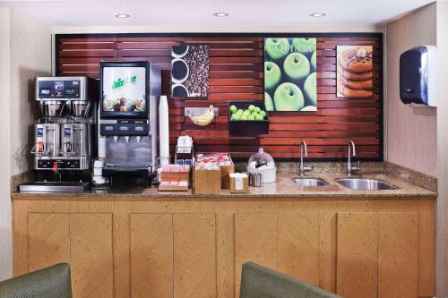 a kitchen with a counter with a coffee shop at La Quinta Inn by Wyndham Amarillo Mid-City in Amarillo