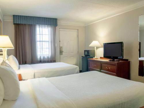 Letto o letti in una camera di La Quinta Inn by Wyndham New Orleans Veterans / Metairie