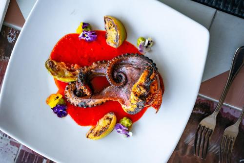 a plate of food with an octopus on it at Gran Hotel Ciudad de Mexico in Mexico City