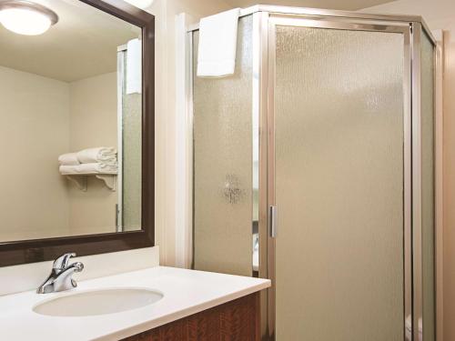 a bathroom with a sink and a shower at La Quinta Inn by Wyndham Vancouver Airport in Richmond