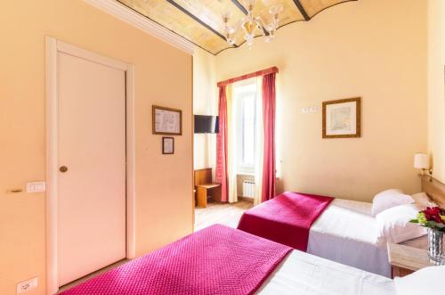 Ένα ή περισσότερα κρεβάτια σε δωμάτιο στο Hotel Tempio Di Pallade