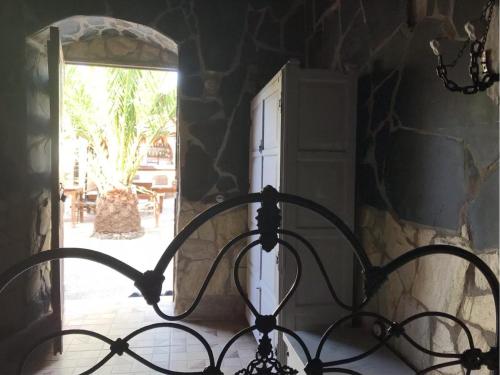a bed in a room with an open door at Casa Princess Arminda in Betancuría