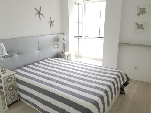Ένα ή περισσότερα κρεβάτια σε δωμάτιο στο Blue Sea Apartment