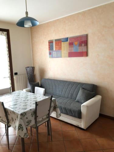 a living room with a couch and a table at Michelino's house in Bologna