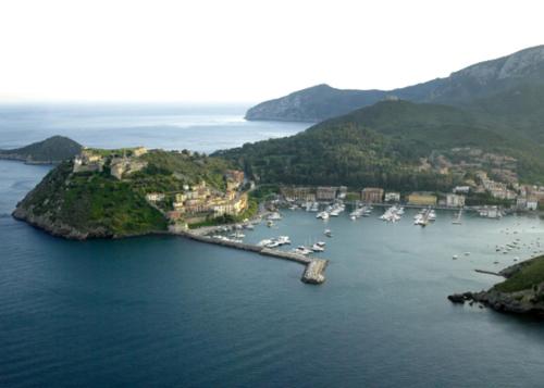 an aerial view of a harbor with boats in the water at PENSIONE VERDE LUNA in Orbetello