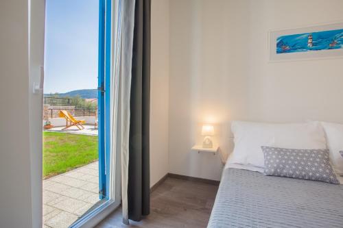 Postel nebo postele na pokoji v ubytování Apartment D
